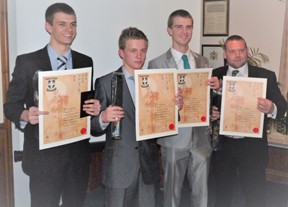 The first batch of new Dan Grades receive their black belts and certificates on Wednesday 12th December 2012